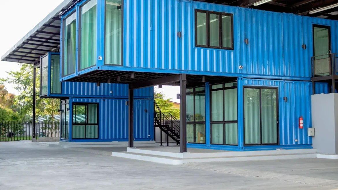 modern two-story shipping container commercial building featuring stacked blue 40ft containers